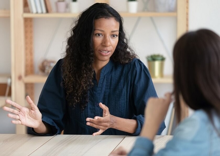 Close up confident african american businesswoman explaining new responsibilities.